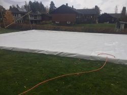 Before the ice is flushed onto the artificially frozen ice rink
